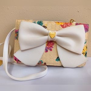 White and floral patterned Betsey Johnson crossbody purse